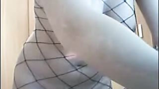 Sexy lady in fish net chatting behind her cam