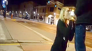 A blonde with big tits sucks a cock in the street