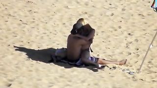 Hidden livecam scene with a pair banging in the cowgirl pose on a beach