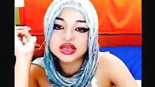 Paki doxy in scarf shows her tits and fingers her snatch