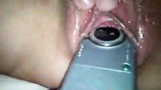 Putting a cellphone inside a condom and stuffing it inside her sopping pussy
