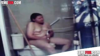 Hidden cam catches my kinky fat wife masturbating in toilet.