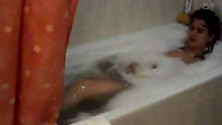 Busty wife filmed in the tub masturbating her wet pussy