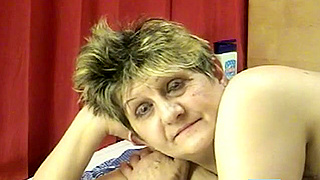 Big-Breasted Granny Pleasures Herself with Dildo on Webcam Live Show