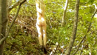 Busty Blonde Babe Endures Intense Whipping in the Isolated Woods