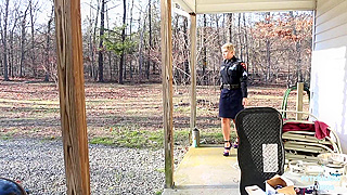 Short-haired policewoman is stripping and showing off to a criminal