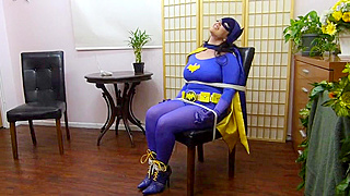 Tied up MILF dressed as Batwoman gets knocked the fuck out by a villain