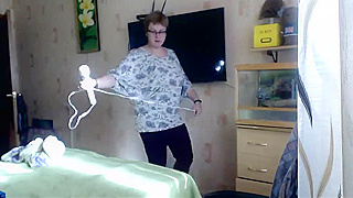 Hidden Camera Catches Mature Slut Watching Porn And Masturbating Hard